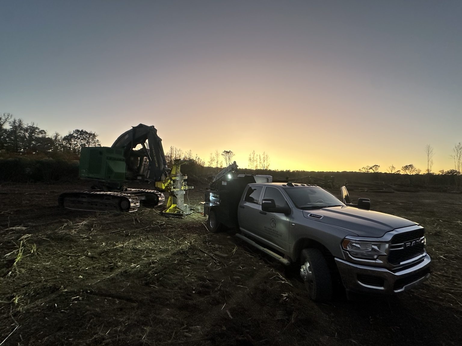 Mobile service truck and forestry equipment at sunset
